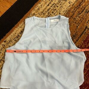 Joteisy light blue ruffle romper. Size medium.